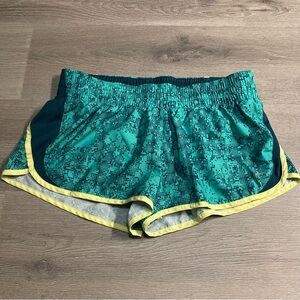 Nike green running shorts, large